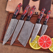Crimson Vortex 5-piece Damascus chef knife set with red and black dyed wood handles and leather roll by Shard Blade