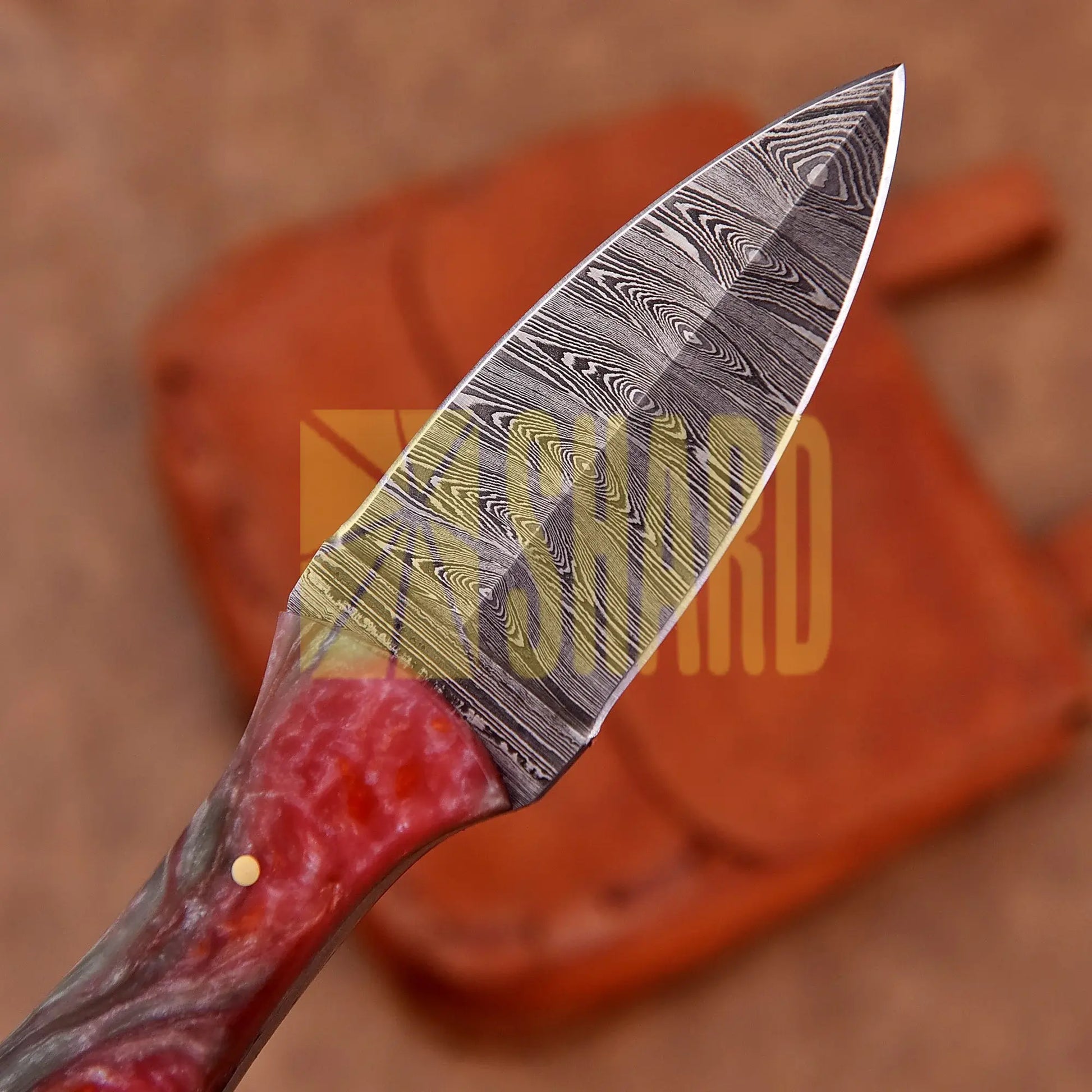 Hand-forged Damascus steel collectible with raindrop pattern and ruby red mixed resin handle – Eternal Raindrop gift piece