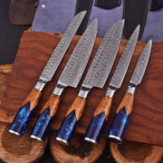 Handmade Oceanhearth Damascus Chef Set with natural wood and deep ocean resin handles – 5-piece collectible culinary set with leather roll.