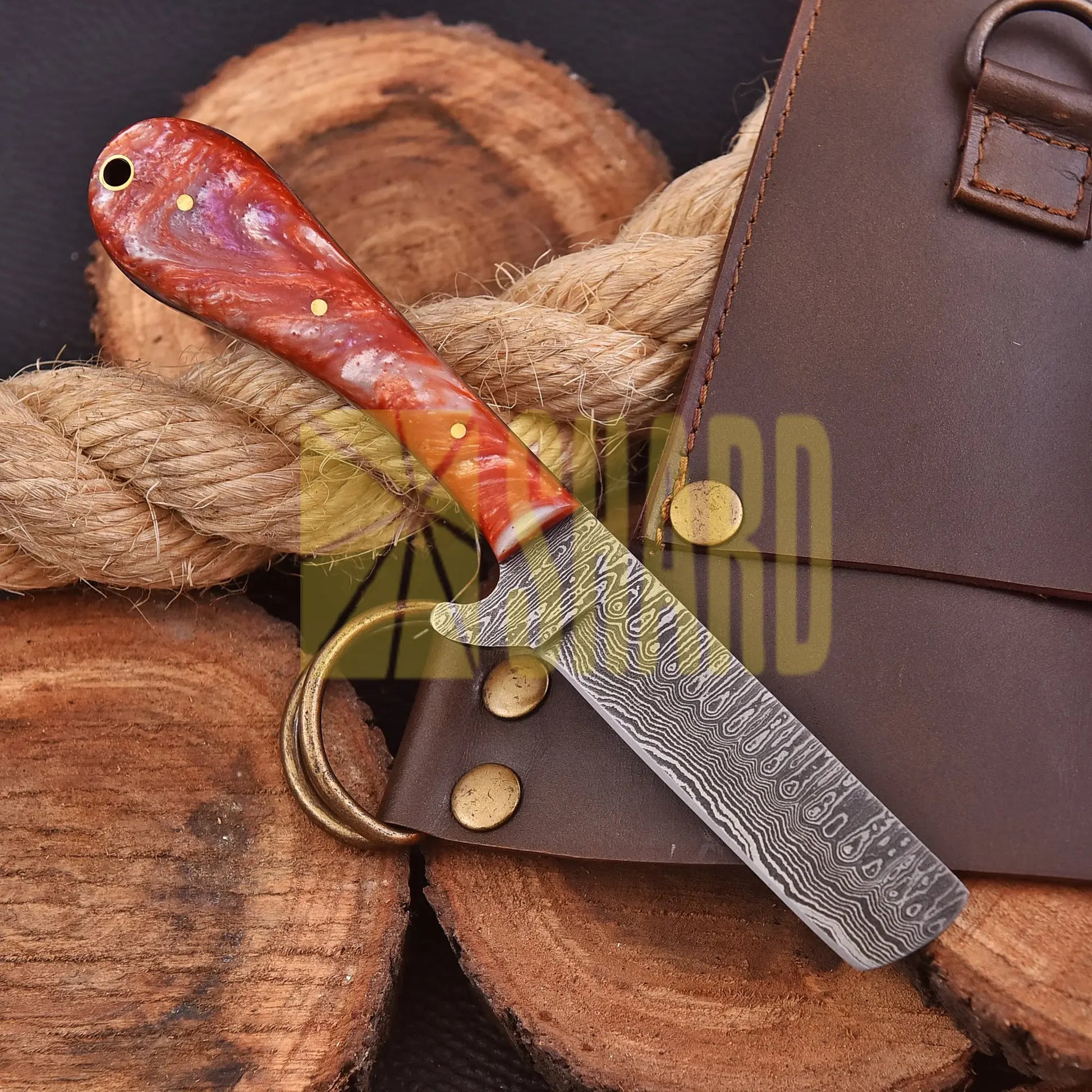 Handcrafted Riverstone Guppy kitchen collectible with Damascus raindrop pattern and stone resin handle