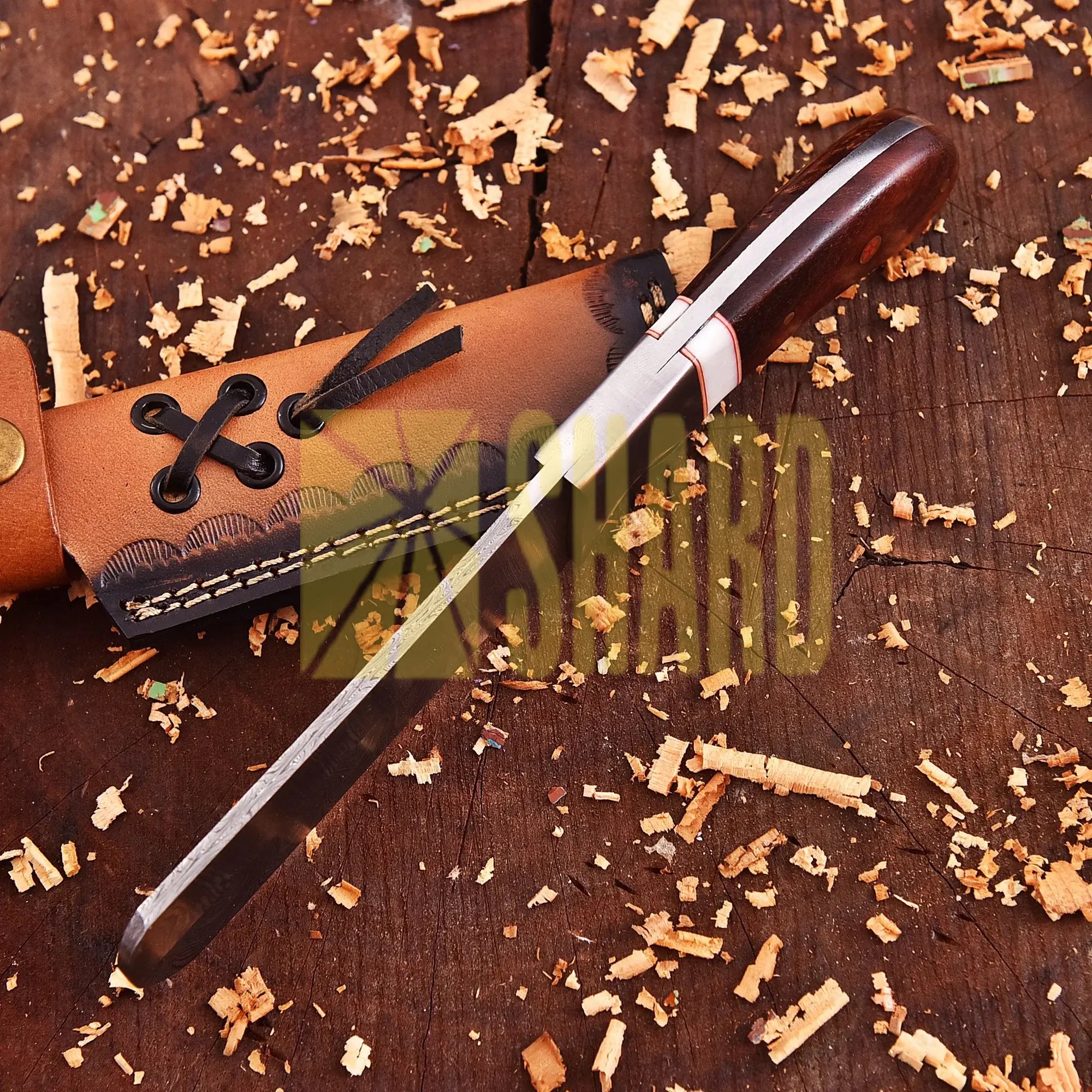 Hand-forged Damascus raindrop steel chef’s tool with steel bolster and Coralfin rosewood handle – Coralfin by Shard Blade