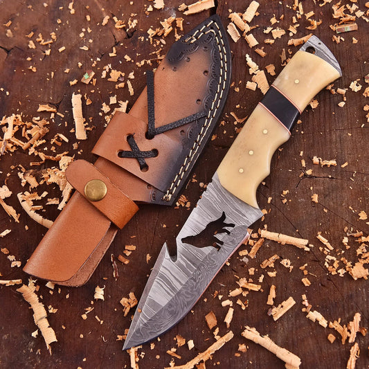 Lunar Howl Damascus collectible with wolf cut-out design and bone handle